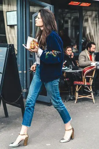 Women wearing parisian chic bomber jacket with denim jeans