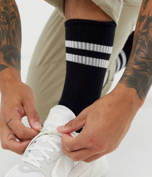 Photo by Asos (Asos Design Sports Socks in Black with White Stripe)