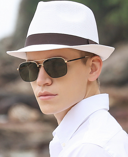 Man wearing Panama hat with sunglasses