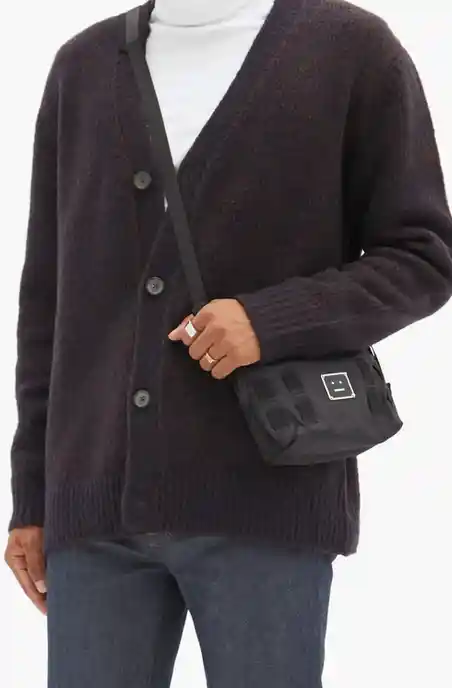Man wearing a Acne Studios Kabelo Rib-knitted Wool-blend Cardigan