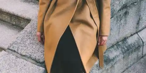 Women wearing long brown winter coat