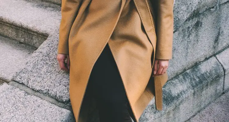 Women wearing long brown winter coat