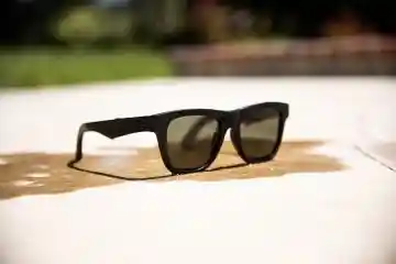 Black retro sunglasses on a table