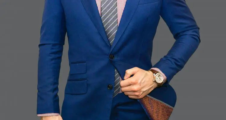 Man wearing blue suit with watch