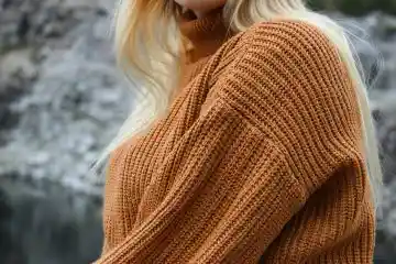 woman wearing a brown pullover turtleneck sweater
