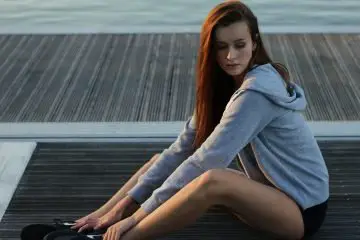 woman wearing grey hoodie with shorts
