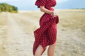 woman wearing red polka dot dress