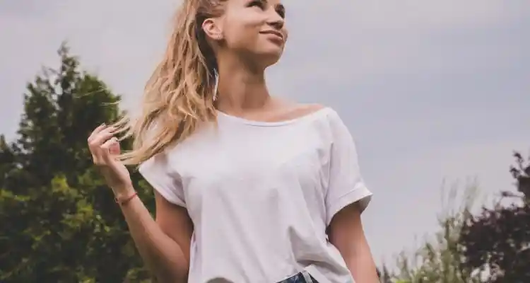 woman wearing white t-shirt and button up denim skirt