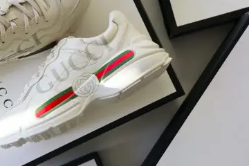 Gucci white sneakers and Gucci bags