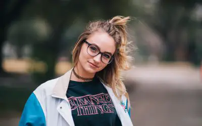 Women wearing 80s style clothing with windbreaker jacket and stranger things t-shirt